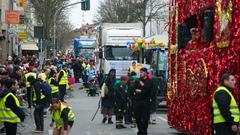 Das Sicherheitspersonal sorgt dafür, dass niemand den Umzugswagen zu Nahe kommen. (Foto: SR)